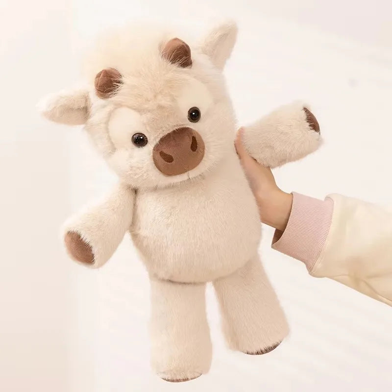 Toffee held up by one hand, showing its size